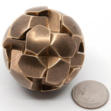 Load image into Gallery viewer, Close up of "Never Mind the Ball Locks Here's the Gumball Puzzle" face on showing a four fold axis of symmetry,