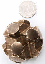 Load image into Gallery viewer, Assembled brass gumball puzzle.  Shot from above with a US quarter for size comparison