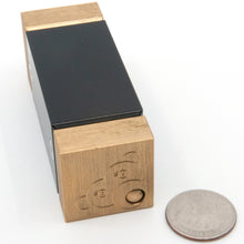 Load image into Gallery viewer, Feed the Monkey puzzle in solved position laid on it's side. A US quarter is shown for scale.