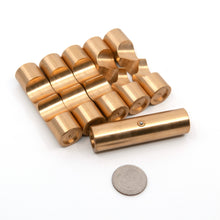 Load image into Gallery viewer, Brass Monkey One puzzle pieces layed out in a row. The sprung loaded ball bearing that helps hold the key piece in the puzzle is shown at the front of the picture.