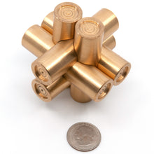 Load image into Gallery viewer, Brass Monkey Three Puzzle stood vertically on one pair of pieces. The single central indent with two concentric rings differentiate it from the other Brass Monkey Puzzles.