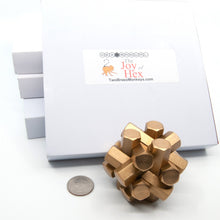 Load image into Gallery viewer, A stack of Hex boxes in their white sleeves