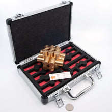 Load image into Gallery viewer, The might Kong interlocking brass puzzle sitting in it's aluminium carry case.