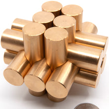 Load image into Gallery viewer, Assembled Kong Puzzle, 13 cylindrical metal pieces interlocking to form a heavy brass puzzle. Makes for an imposing desk ornament,
