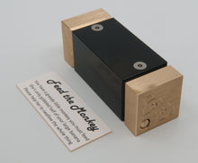 Load image into Gallery viewer, Female Feed the Monkey puzzle laid along side the info card. The male version is identical aside from the absence of eye lashes on the puzzle and the use of he/him pronouns on the card.