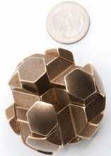 Load image into Gallery viewer, Assembled brass gumball puzzle.  Shot from above with a US quarter for size comparison
