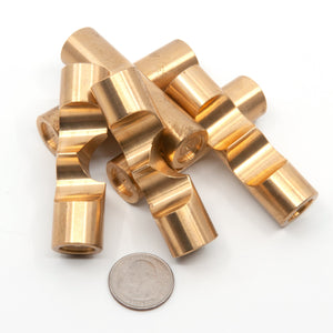  Disassembled pieces of Brass Monkey Two. Each piece is 70mm long and 19mm in diameter, a US quarter in the foreground illustrates the scale.
