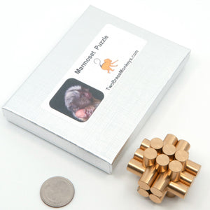 Marmoset interlocking thirteen piece metal puzzle and box.