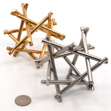 Load image into Gallery viewer, A pair of metal Nova Plexus puzzles. One brass, one stainless steel.
