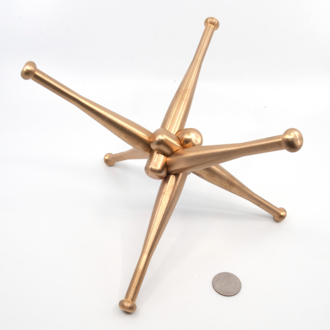 Assembled Heavy Hitter Puzzle with a quarter to illustrate size. 