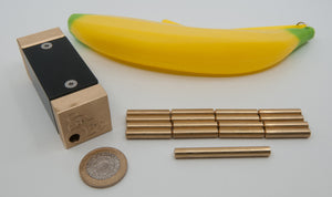 One Peckish Primate, One rubber banana, Sixteen small brass bananas, One large brass banana, and a UK Two Pound Coin.