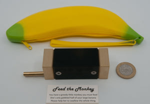 Feed the Monkey Puzzle together with package. We decided to have fun with this one, and use the inspired choice of a rubber banana, for some somewhat unusual packaging.